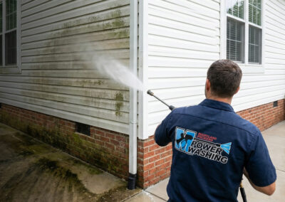 Professional power washing of residential home siding in Maryland