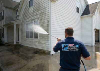 Professional power washing of residential home siding in Maryland